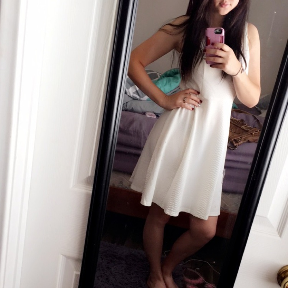 White dress tight on top flows at the bottom